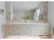 Bathroom vanity with double sinks and large mirror at 1337 Grey Fox Ne Ct, Atlanta, GA 30306