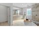 Elegant bathroom featuring a soaking tub, glass-enclosed shower, and dual vanities for a spa-like experience at 1337 Grey Fox Ne Ct, Atlanta, GA 30306