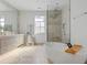 Luxurious bathroom with soaking tub, glass-enclosed shower, and dual vanities, creating a spa-like retreat at 1337 Grey Fox Ne Ct, Atlanta, GA 30306