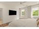 Light-filled bedroom with hardwood floors and natural light from the windows at 1337 Grey Fox Ne Ct, Atlanta, GA 30306