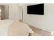 Bright bedroom featuring wood floors and a wall-mounted television at 1337 Grey Fox Ne Ct, Atlanta, GA 30306
