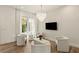 Bright living room with large windows, contemporary furniture, and elegant chandelier at 1337 Grey Fox Ne Ct, Atlanta, GA 30306