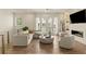 Bright living room featuring modern furnishings, fireplace, and hardwood floors, creating an inviting atmosphere at 1337 Grey Fox Ne Ct, Atlanta, GA 30306