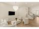 Open living room with sleek furniture, modern lighting, and a spacious layout at 1337 Grey Fox Ne Ct, Atlanta, GA 30306
