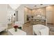 Open-concept living space featuring kitchen with center island, view of staircase, and modern decor at 1337 Grey Fox Ne Ct, Atlanta, GA 30306
