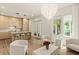Stylish living space with modern kitchen, elegant lighting, and white furniture, creating a contemporary ambiance at 1337 Grey Fox Ne Ct, Atlanta, GA 30306