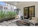 Charming outdoor patio featuring a sleek fire pit, comfortable seating, and privacy greenery at 1337 Grey Fox Ne Ct, Atlanta, GA 30306