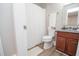 Functional bathroom features tile floors, toilet, sink with vanity, and a shower with a white curtain at 418 Robinson Rd, Peachtree City, GA 30269