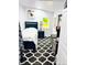 Cozy bedroom features a patterned rug, blue bed frame, and white walls for a modern feel at 418 Robinson Rd, Peachtree City, GA 30269