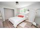 This light-filled bedroom showcases neutral walls, wood floors, and an accent wall for a modern aesthetic at 418 Robinson Rd, Peachtree City, GA 30269