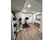 Bright workout room includes wood floors, neutral walls, exercise equipment, and ample space at 418 Robinson Rd, Peachtree City, GA 30269