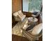Cozy screened-in porch with comfortable seating and a stylish rug at 418 Robinson Rd, Peachtree City, GA 30269