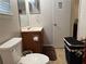 This bathroom features a vanity with a sink, a mirror, and a toilet at 6490 Emerald Pointe Circle, Atlanta, GA 30349