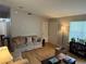 Comfortable living area with hardwood floors, a cozy sofa, and a bright window at 6490 Emerald Pointe Circle, Atlanta, GA 30349
