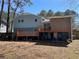 Spacious backyard featuring a wooden deck and a privacy fence at 6675 Hidden Brook Trl, Atlanta, GA 30349