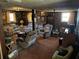 Finished basement featuring wood-paneled walls and classic furniture arrangement at 6675 Hidden Brook Trl, Atlanta, GA 30349