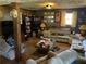 Finished basement featuring wood-paneled walls and classic furniture arrangement at 6675 Hidden Brook Trl, Atlanta, GA 30349