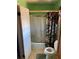 Bathroom featuring a shower with sliding glass doors and a floral curtain at 6675 Hidden Brook Trl, Atlanta, GA 30349