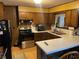 Functional kitchen featuring stainless steel appliances and wood cabinets at 6675 Hidden Brook Trl, Atlanta, GA 30349
