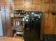 Functional kitchen with black appliances and classic wood cabinetry at 6675 Hidden Brook Trl, Atlanta, GA 30349