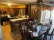 Cozy kitchen with breakfast bar and dining table with wood cabinets at 6675 Hidden Brook Trl, Atlanta, GA 30349