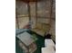 Covered patio area featuring a chair, loveseat, glass table, and lattice walls at 6675 Hidden Brook Trl, Atlanta, GA 30349