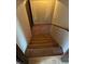 Carpeted stairway leading to upper or lower level with wooden handrail at 6675 Hidden Brook Trl, Atlanta, GA 30349