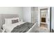 Cozy bedroom with ensuite bathroom, plush carpet, and a calming, neutral color scheme at 3610 Central Park Dr, Loganville, GA 30052