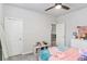 Bedroom featuring neutral-colored walls, carpet and a ceiling fan with light at 3610 Central Park Dr, Loganville, GA 30052