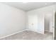 Empty bedroom featuring carpet, a double-door closet and neutral colored walls at 3610 Central Park Dr, Loganville, GA 30052