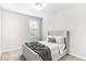 Bright bedroom featuring neutral tones, plush carpet, and natural light from the window at 3610 Central Park Dr, Loganville, GA 30052