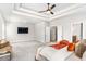 Light and bright primary bedroom with neutral walls, ensuite access, and plush carpet at 3610 Central Park Dr, Loganville, GA 30052