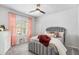 Charming bedroom with plush carpet, neutral walls, decorative curtain panels, and a window at 3610 Central Park Dr, Loganville, GA 30052