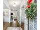 Welcoming entryway with hardwood floors, white trim, and a view into the living space at 3610 Central Park Dr, Loganville, GA 30052