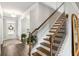 Light and airy entryway featuring hardwood floors, staircase and views of other rooms at 3610 Central Park Dr, Loganville, GA 30052