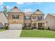 Beautiful two-story brick home with a well-manicured lawn and inviting front porch at 3610 Central Park Dr, Loganville, GA 30052