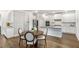 Bright kitchen with stainless steel appliances, an island with bar seating, and eat-in kitchen at 3610 Central Park Dr, Loganville, GA 30052