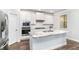 Bright kitchen with stainless steel appliances, granite countertops, and modern white cabinetry at 3610 Central Park Dr, Loganville, GA 30052