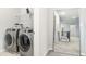 Convenient laundry room with modern washer and dryer units and storage at 3610 Central Park Dr, Loganville, GA 30052