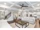 Open-concept living room with modern decor, coffered ceiling, and hardwood floors at 3610 Central Park Dr, Loganville, GA 30052