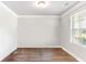 A versatile room with hardwood floors and a window providing natural light at 3610 Central Park Dr, Loganville, GA 30052
