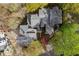 An elevated view of a home and its well-maintained roof with mature landscaping at 8207 Fairview Blf, Alpharetta, GA 30022