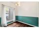 Charming dining area with bright window, hardwood floors, and neutral décor for comfortable living at 8207 Fairview Blf, Alpharetta, GA 30022