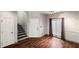 Entryway with hardwood floors, gray trim, stairs and neutral-toned walls at 8207 Fairview Blf, Alpharetta, GA 30022