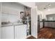 Convenient laundry room with washer, dryer, water heater, and ample storage space adjacent to kitchen at 8207 Fairview Blf, Alpharetta, GA 30022