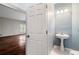 Cozy powder room with a pedestal sink at 8207 Fairview Blf, Alpharetta, GA 30022