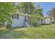 Charming one-story home with a covered front porch and a well-maintained front yard at 1105 S Parkwood Dr, Forest Park, GA 30297
