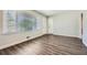 Spacious living room with hardwood floors, natural light, and a welcoming entrance at 1105 S Parkwood Dr, Forest Park, GA 30297