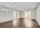 Spacious living room with sliding glass door and dark floors at 1105 S Parkwood Dr, Forest Park, GA 30297