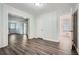 Inviting living room with wood-look flooring and neutral walls showcasing a light, open atmosphere at 1105 S Parkwood Dr, Forest Park, GA 30297